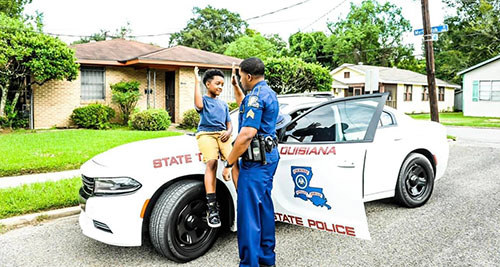 Trooper giving a child a "high five"