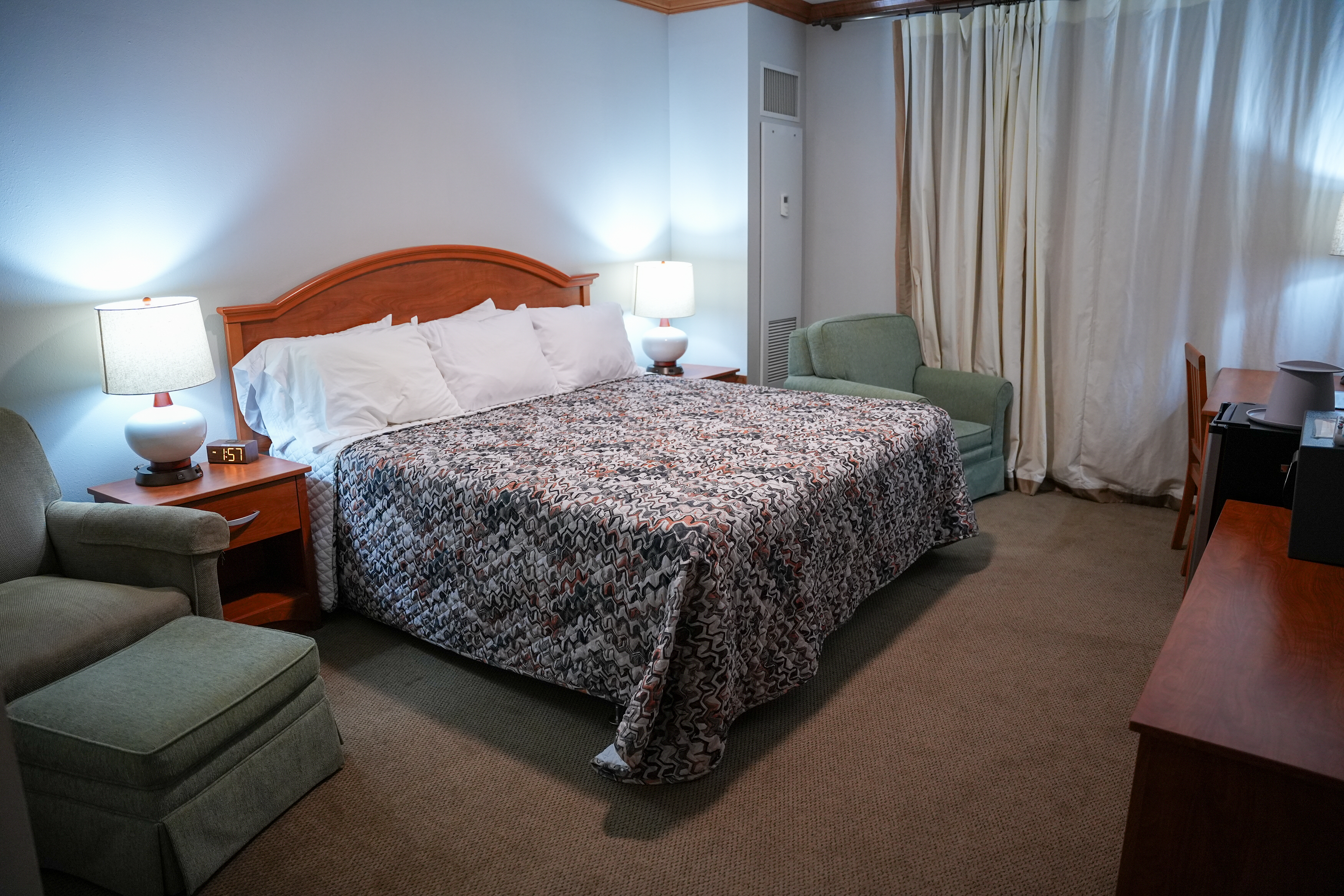 Guest room with king bed at the Staff Development Center