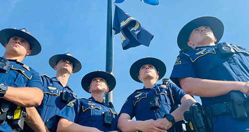 5 Troopers in Front of a Flag